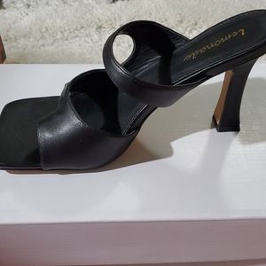 Trendy black square heels toes.